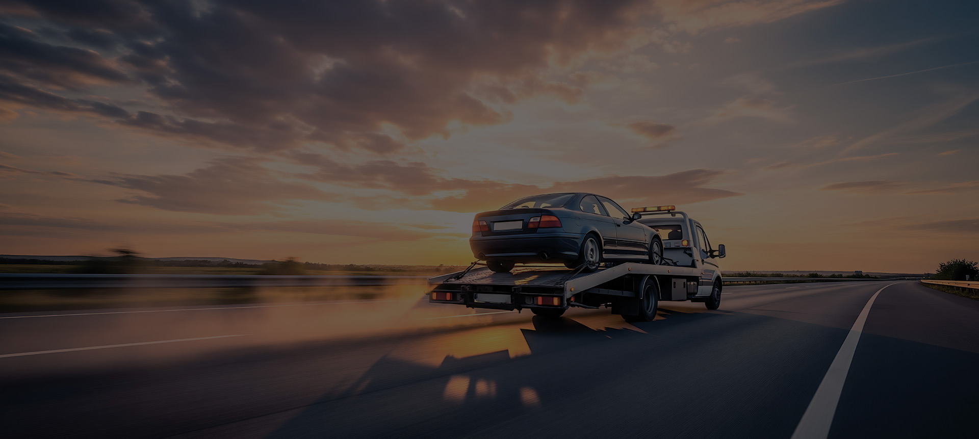 Flatbed Tow Truck With Vehicle On It